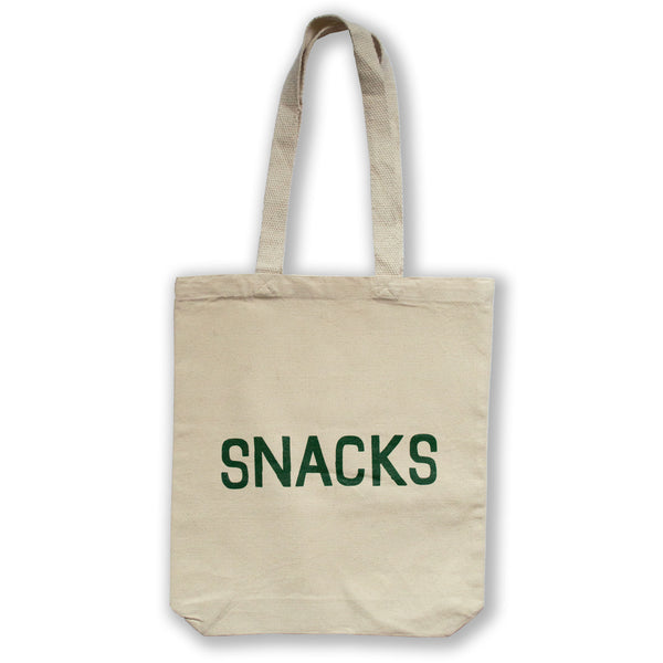 canvas tote embroidered with the word "snacks" in dark green all caps