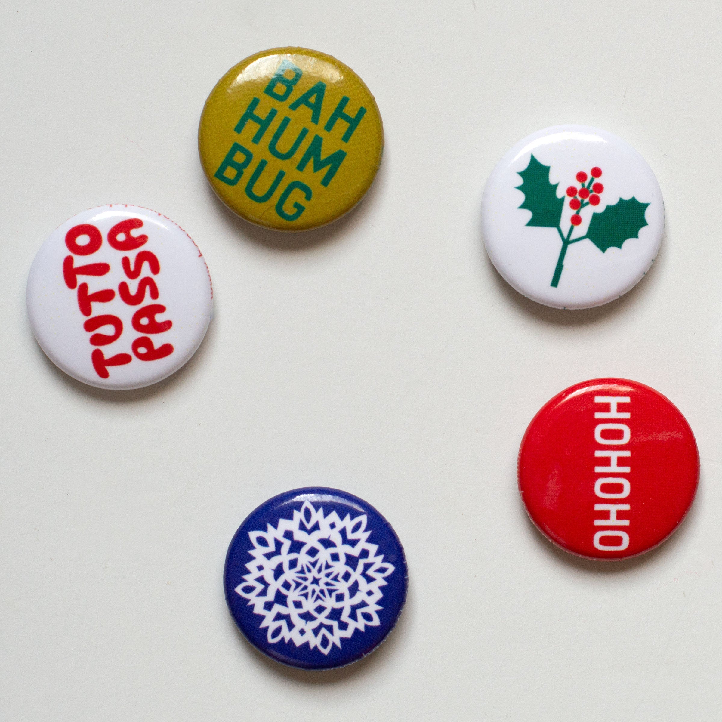 a few pins snowflake ho ho ho tutto passa bah humbug misteltoe