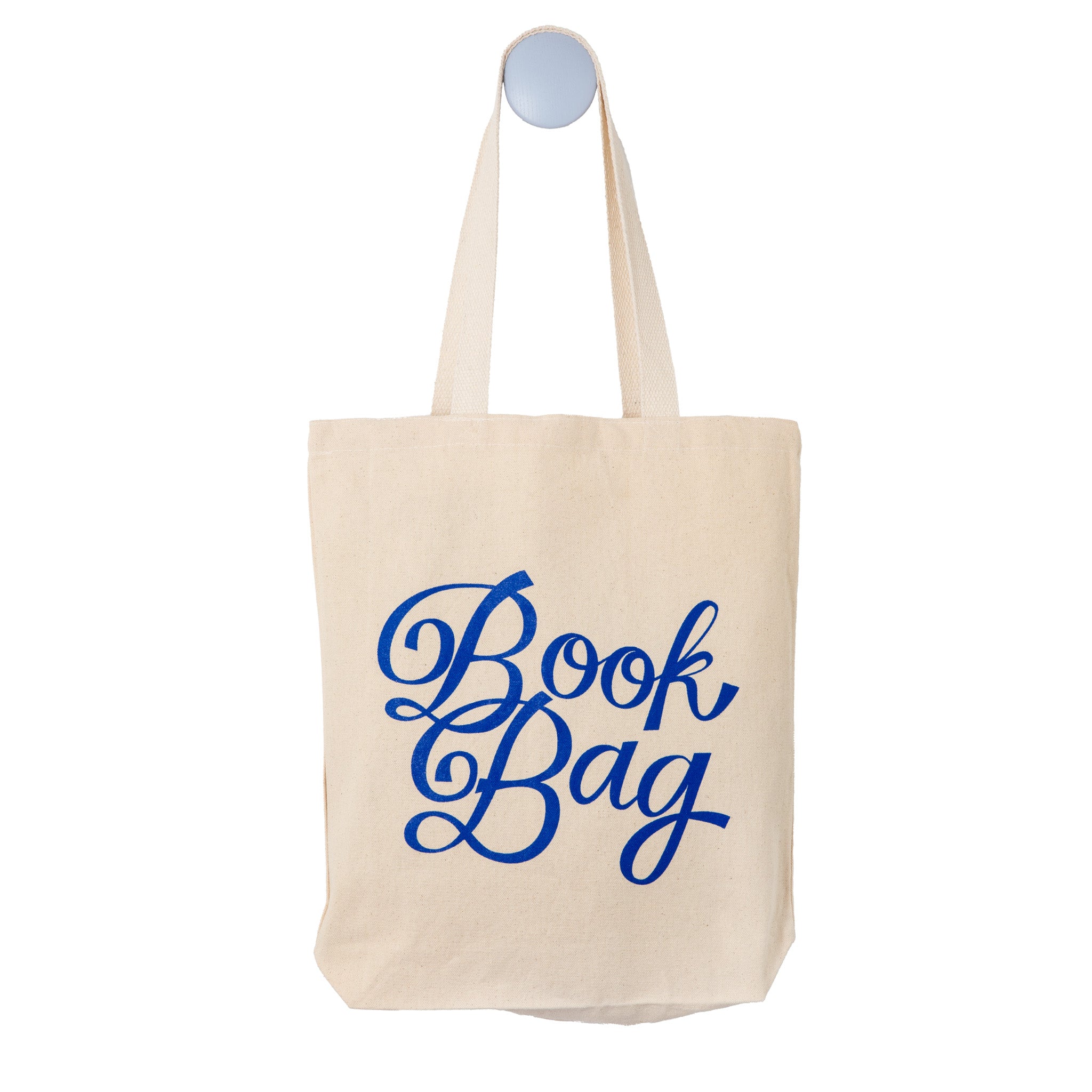 Beige tote bag with 'Book Bag' text in blue on a white background