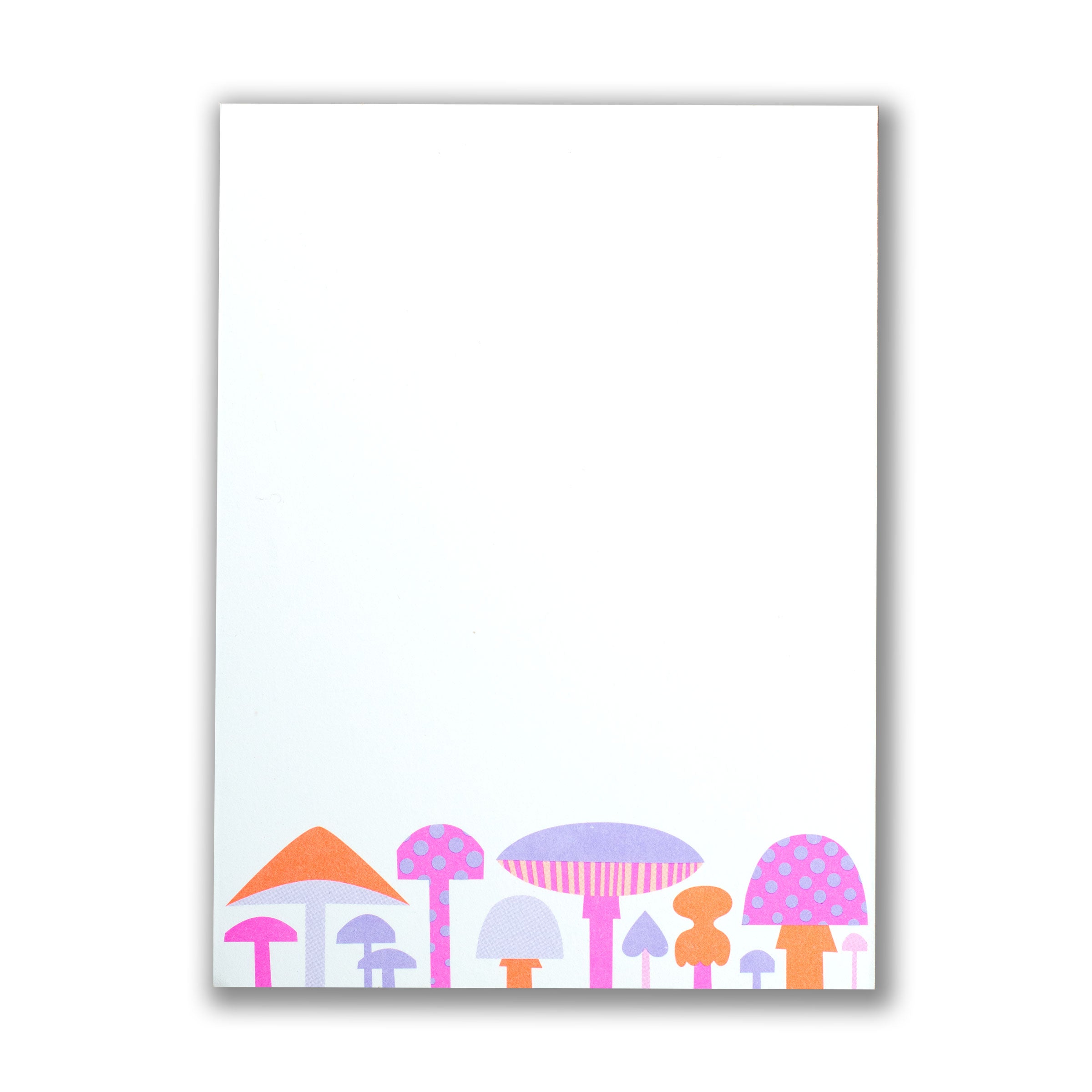 a notepad with colourful mushroom illustrations on a white background