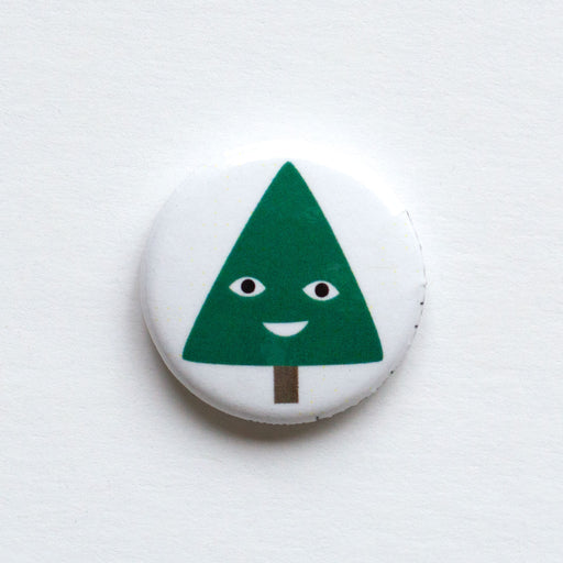 holiday themed 1" button with a smiling christmas tree