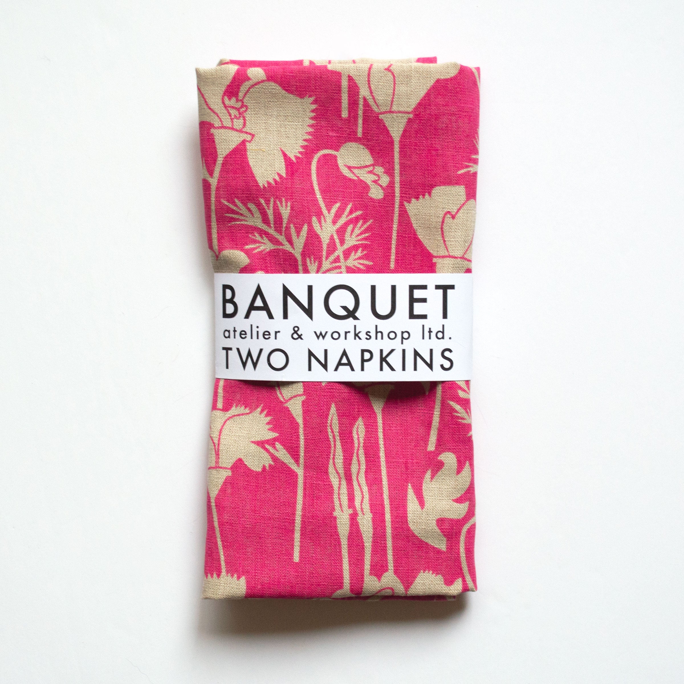 gorgeous raspberry pink poppies reverse printed on a pair of all linen napkins