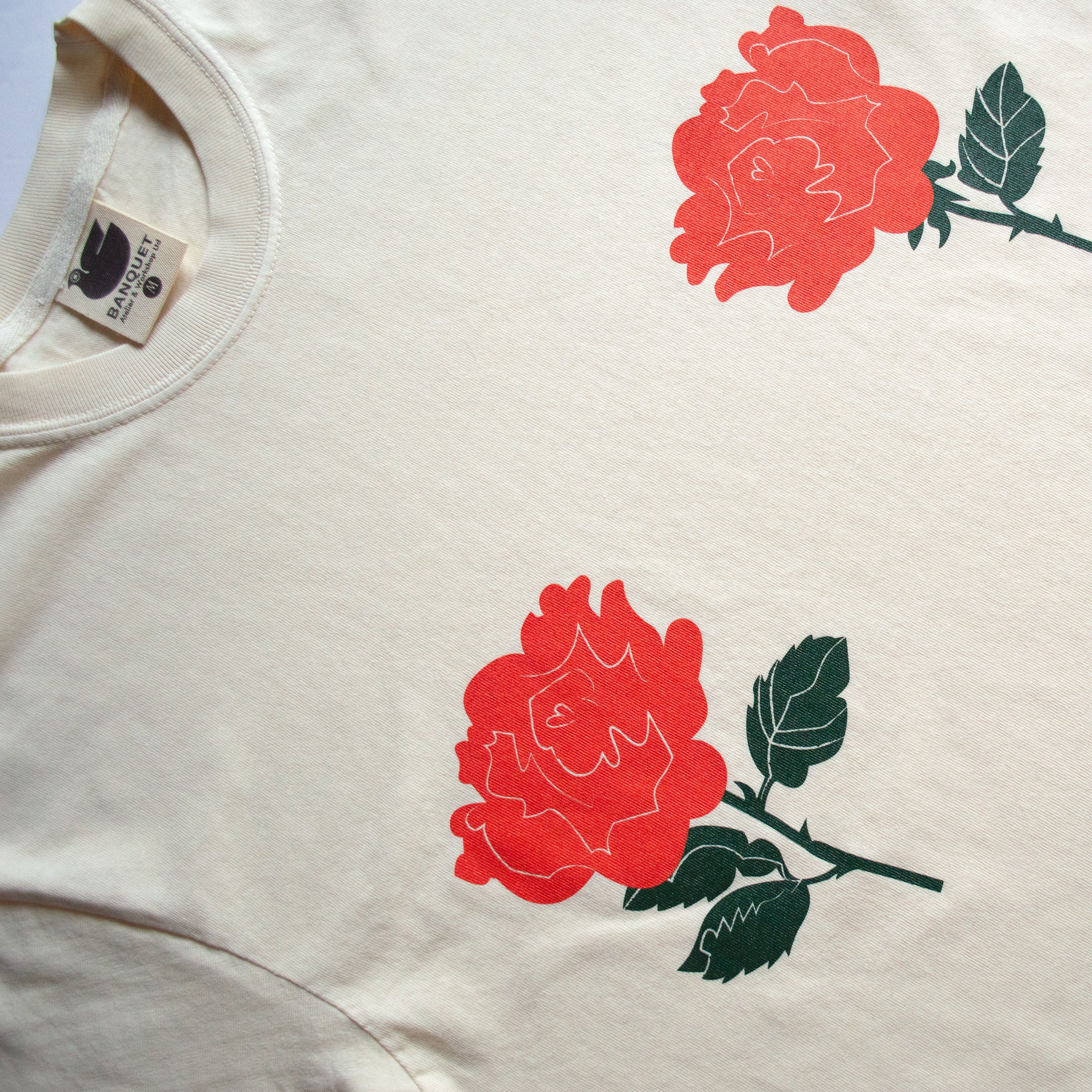 rose t shirt lying flat