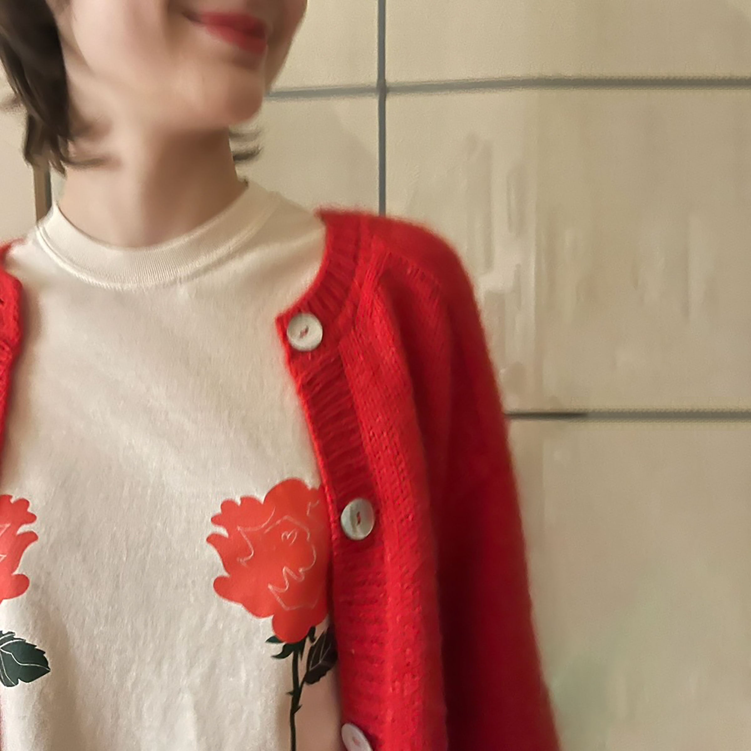 woman wearing red roses shirt