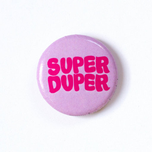 Super Duper in magenta and lavender Bubble Letters on a 1" lapel pin/button