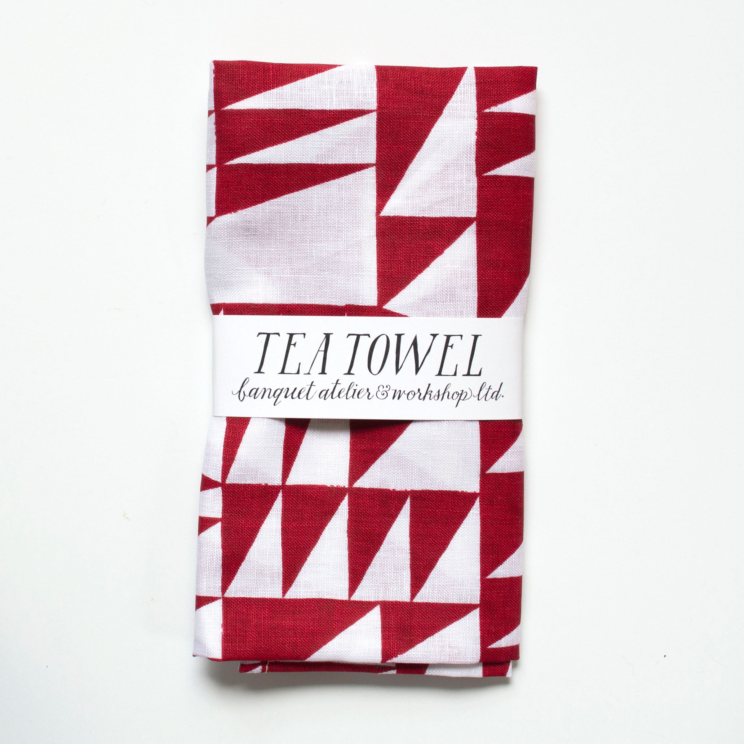 red burgundy brick triangles on white linen tea towel