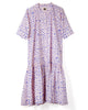 Short-sleeve dress with cobalt blue snowflake pattern on a soft peach cotton