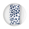 Napkin with blue abstract pattern on a white plate
