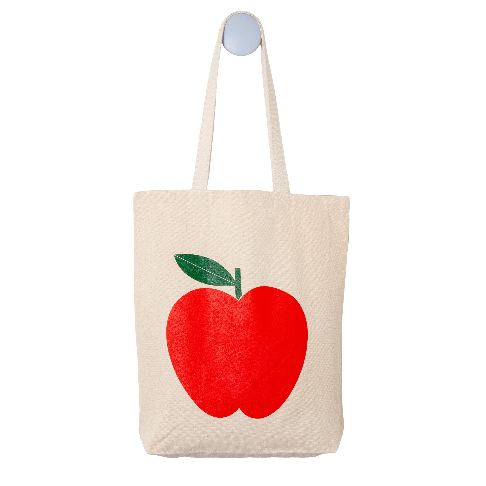 Red Apple screenprinted onto a natural tote bag
