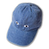 Blue cap with cartoonish eyes on a white background