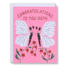 A pair of white moths kissing face to face on this Congratulations to You both card for weddings anniversary