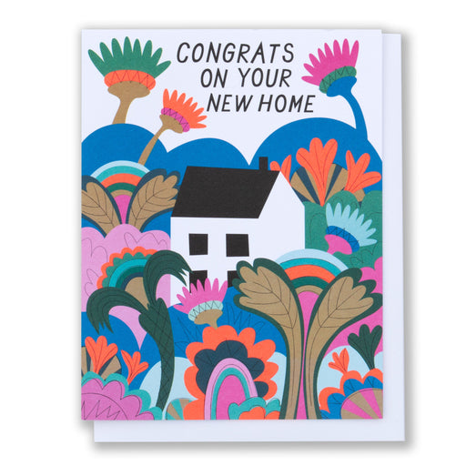 Housewarming card with an illustration of a tiny white house tucked in the middle of a psychedleic garden and the message Congrats on your new home