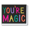 Greeting card with 'YOU'RE MAGIC' text in colorful letters on a black background