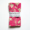 gorgeous raspberry pink poppies reverse printed on a pair of all linen napkins 