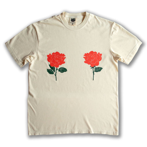 two red roses placed over each boob on a cream t-shirt