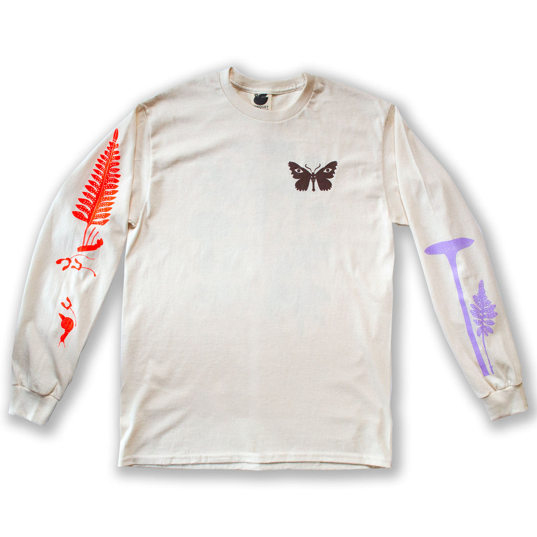 long sleeved shirt printed with a brown moth, neon red fern and snail, and lavender mushroom  Edit alt text
