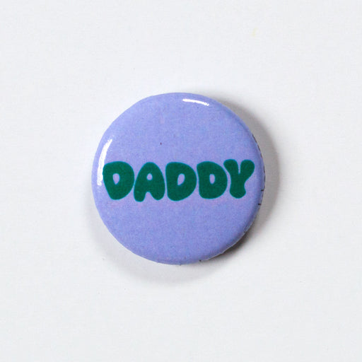 Daddy in green on a 1" round lavender button