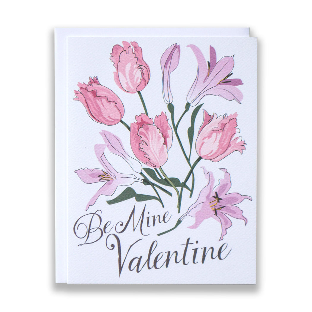 Valentine's note card with tulips and lillies in soft pinks reads be mine valentine at bottom