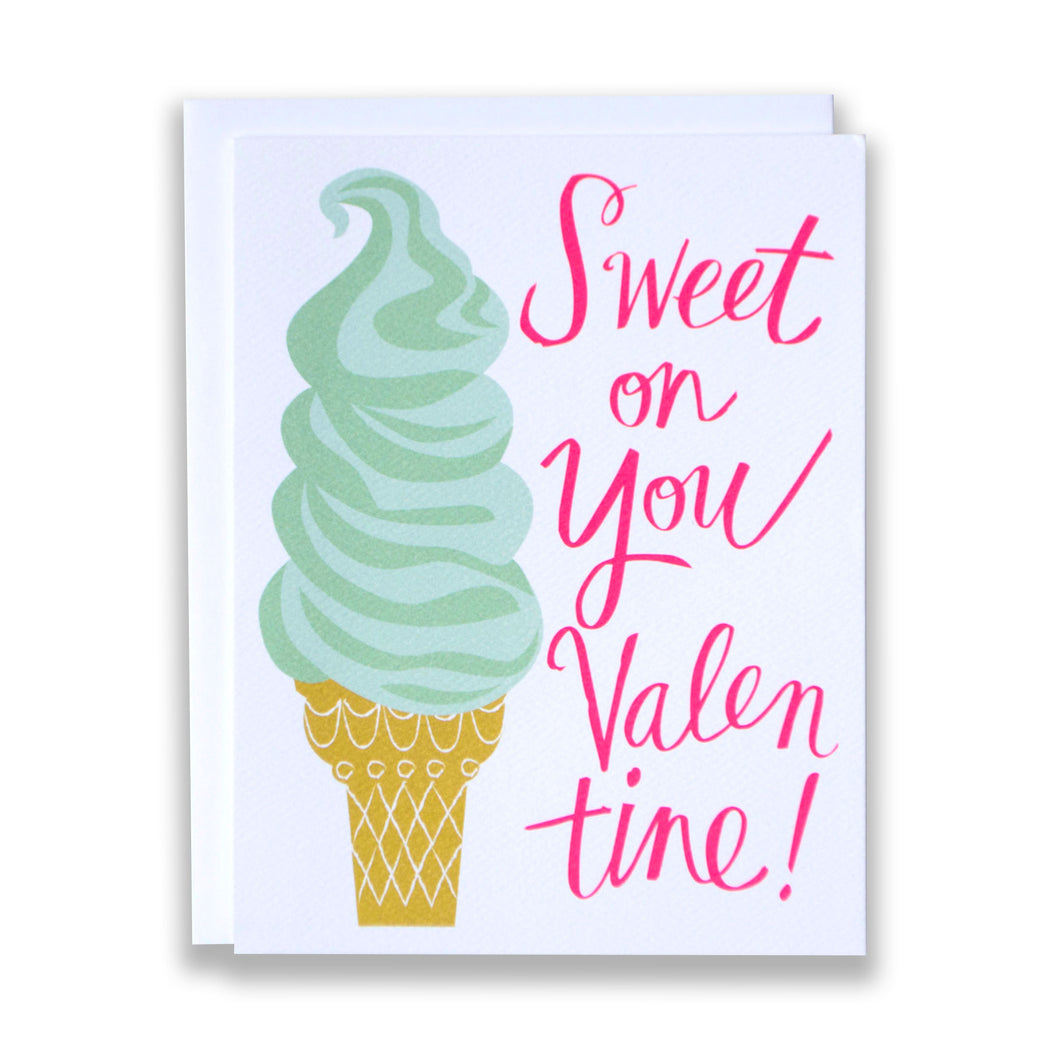 A note card with a drawing of a soft serve ice cream and a neon pink message reading "Sweet on You Valentine!"
