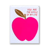 Big red pink apple on a note card reading you are the apple of my eye
