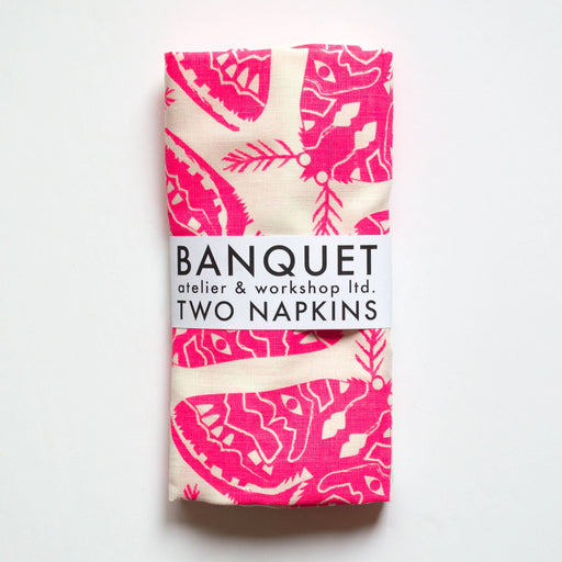 neon pink napkins printed with moths