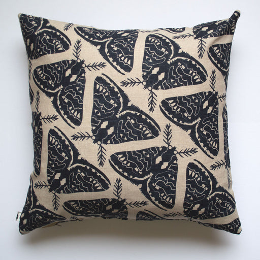 large black moths screenprinted on a linen pillow cover