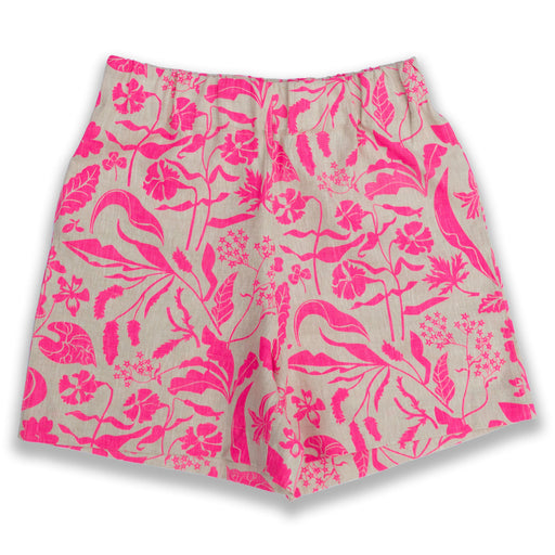 woman's linen shorts printed with a repeating pattern of neon pink spring wildflowers